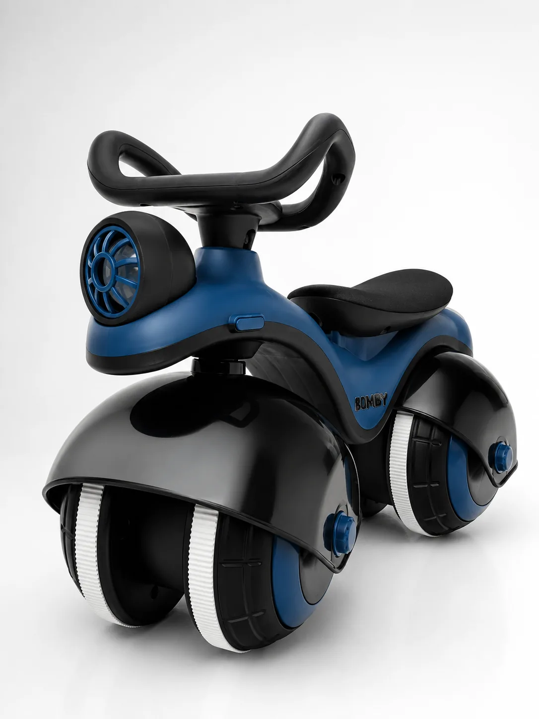 Bomby ride-on in blue, three-quarter studio view